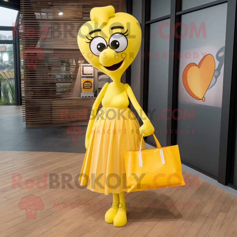 Yellow Heart mascot costume character dressed with a Maxi Skirt and Tote bags