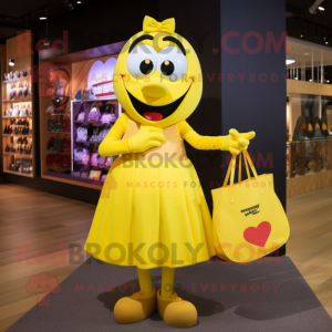 Yellow Heart mascot costume character dressed with a Maxi Skirt and Tote bags