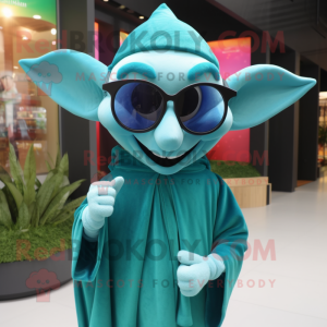 Teal Elf mascot costume character dressed with a Cover-up and Sunglasses