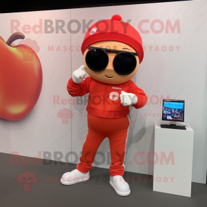 Red Apricot mascot costume character dressed with a Capri Pants and Digital watches