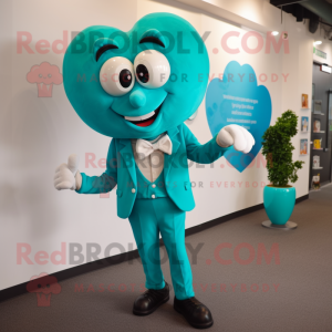 Turquoise Heart mascot costume character dressed with a Suit Pants and Tie pins