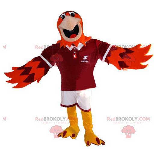 Mascotte d'aigle orange et violet en tenue de sport -