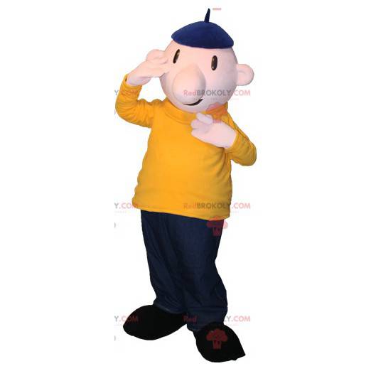 Kale man mascotte met een baret en een kleurrijke outfit -