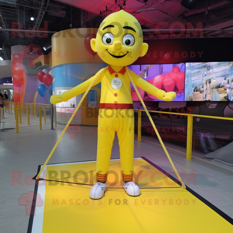 Yellow Tightrope Walker mascot costume character dressed with a Graphic Tee and Keychains