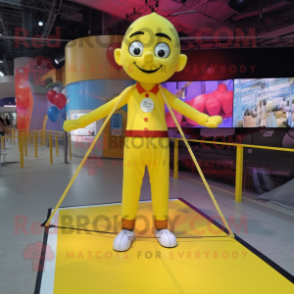 Yellow Tightrope Walker mascot costume character dressed with a Graphic Tee and Keychains