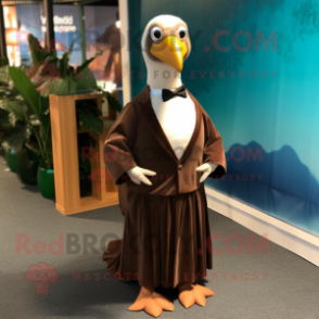 Brown Albatross mascot costume character dressed with a Evening Gown and Ties