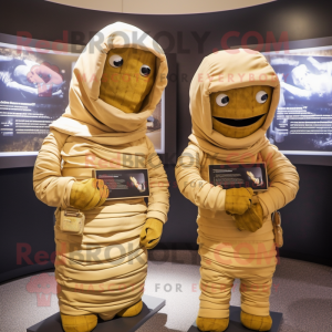 Gold Mummy mascot costume character dressed with a Hoodie and Messenger bags