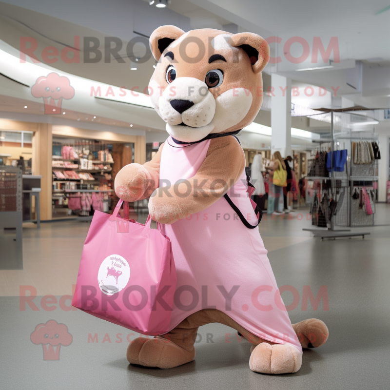 Pink Mountain Lion mascot costume character dressed with a Bodysuit and Tote bags