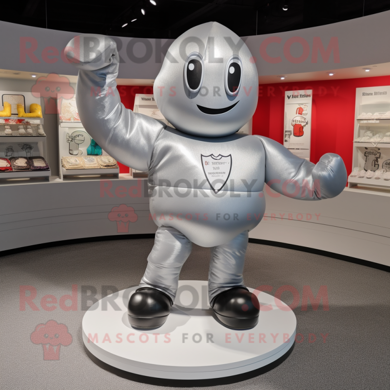 Silver Boxing Glove mascot costume character dressed with a Graphic Tee and Shoe laces