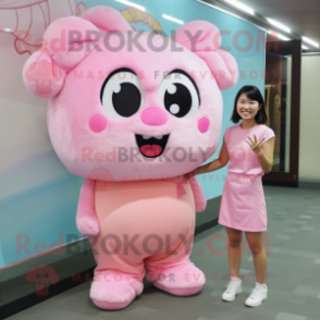 Pink Dim Sum mascot costume character dressed with a Playsuit and Hair clips