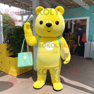 Lemon Yellow Bear mascot costume character dressed with a Jumpsuit and Tote bags