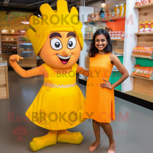 Yellow Tikka Masala mascot costume character dressed with a Mini Skirt and Hair clips