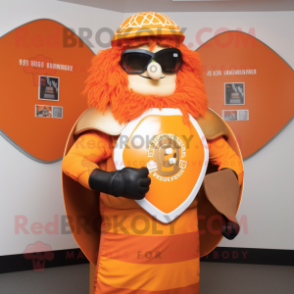 Orange Celtic Shield mascot costume character dressed with a Rash Guard and Sunglasses