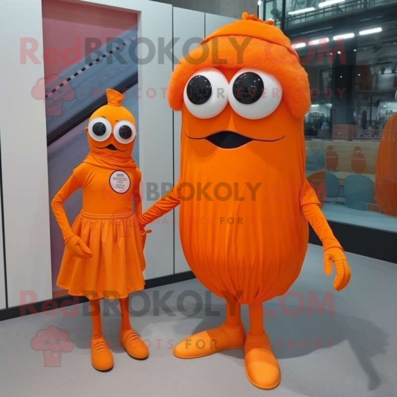 Orange Cyclops mascot costume character dressed with a Midi Dress and Ties