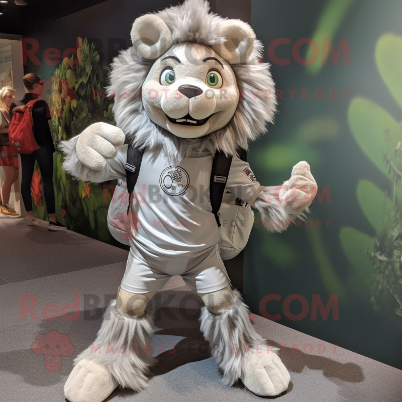 Silver Tamer Lion mascot costume character dressed with a Shift Dress and Backpacks