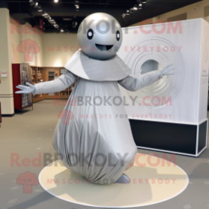 Silver Human Cannon Ball mascot costume character dressed with a Shift Dress and Shawls