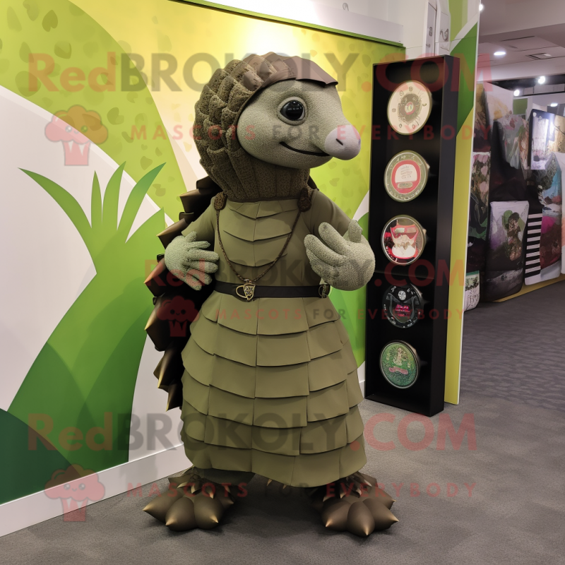 Olive Pangolin Mascot Costume Character Dressed With A Midi Dress And Messenger Bags Mascot 9962