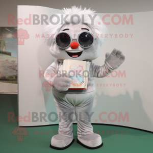 Silver Candy Box mascot costume character dressed with a Corduroy Pants and Reading glasses