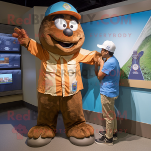 Brown Ice mascot costume character dressed with a Chambray Shirt and Watches