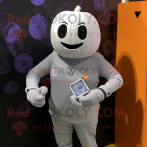 Silver Pumpkin mascot costume character dressed with a Henley Tee and Digital watches