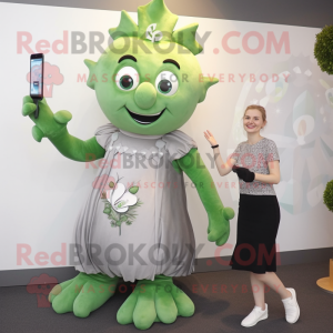 Silver Beanstalk mascot costume character dressed with a A-Line Dress and Digital watches