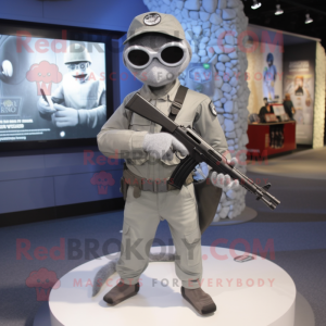 Silver Sniper mascot costume character dressed with a V-Neck Tee and Messenger bags