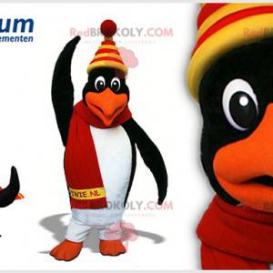 Schwarzweiss-Pinguin-Maskottchen mit einer bunten Kappe -