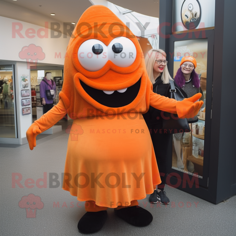 Orange Cyclops mascot costume character dressed with a Maxi Skirt and Berets