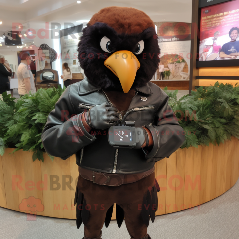 Brown Crow mascot costume character dressed with a Leather Jacket and Smartwatches