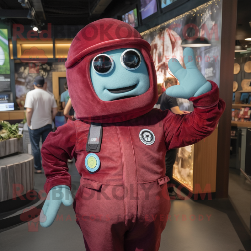 Maroon Astronaut mascot costume character dressed with a Chambray Shirt and Berets