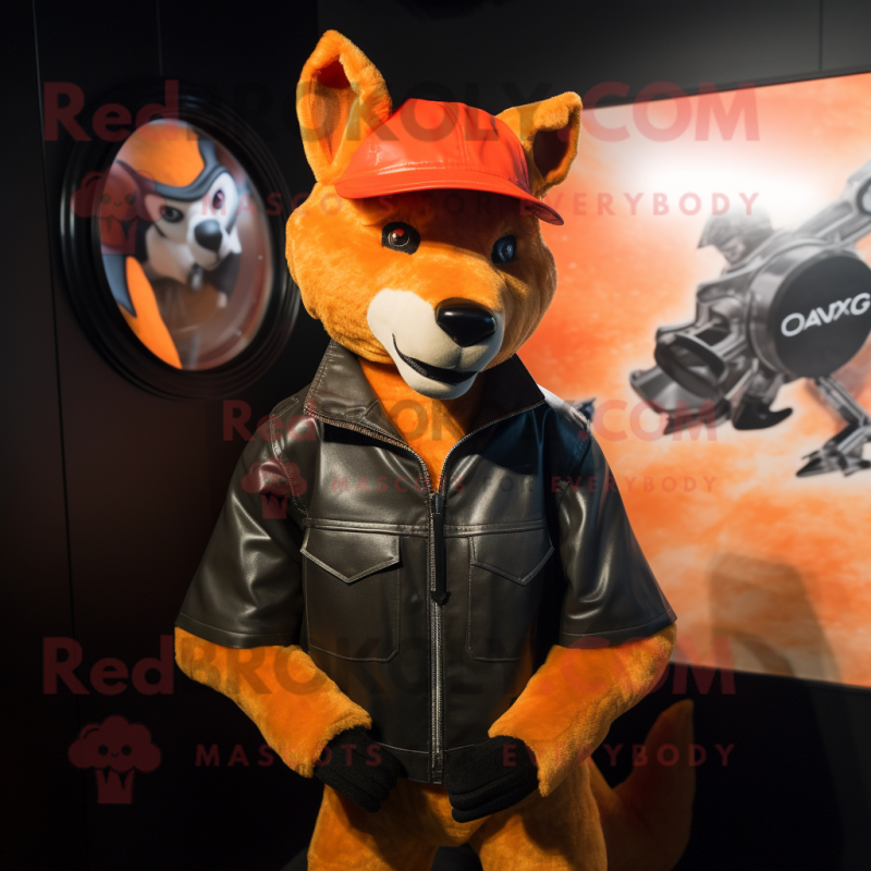 Orange Dingo mascot costume character dressed with a Leather Jacket and Berets