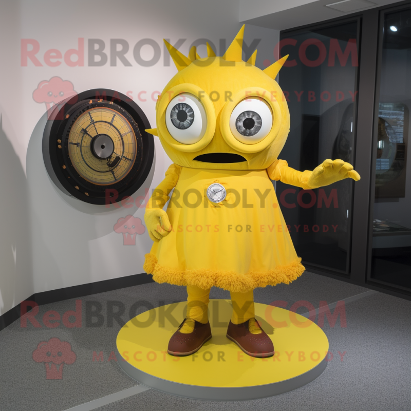 Yellow Cyclops mascot costume character dressed with a Circle Skirt and Watches