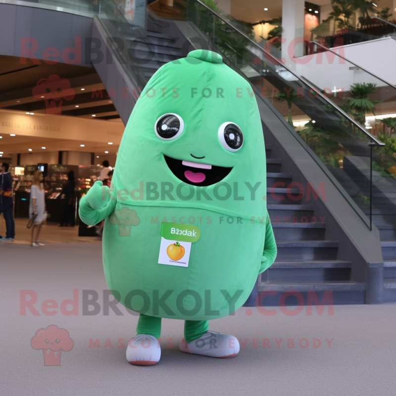 Peach Green Bean mascot costume character dressed with a Flare Jeans and Digital watches