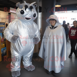 Silver Steak mascot costume character dressed with a Cover-up and Watches