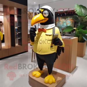 Gold Toucan mascot costume character dressed with a Oxford Shirt and Eyeglasses