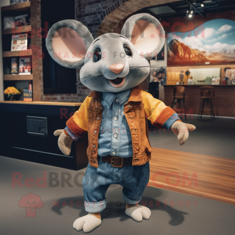 Rust Mouse mascot costume character dressed with a Boyfriend Jeans and Lapel pins