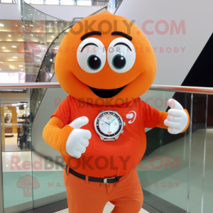 Orange Engagement Ring mascot costume character dressed with a T-Shirt and Bracelet watches