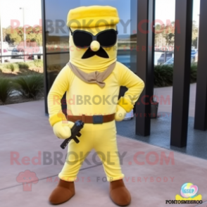 Lemon Yellow Commando mascot costume character dressed with a Corduroy Pants and Eyeglasses