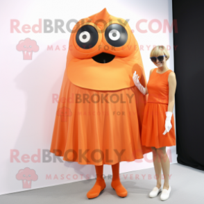 Orange Cyclops mascot costume character dressed with a Sheath Dress and Wraps