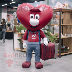 Maroon Heart Shaped Balloons mascot costume character dressed with a Jeans and Briefcases