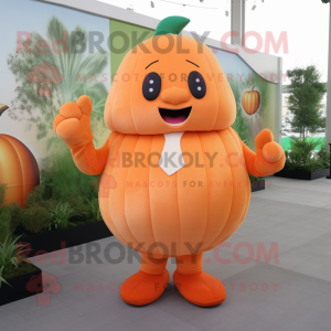 Peach Pumpkin mascot costume character dressed with a Long Sleeve Tee and Tie pins