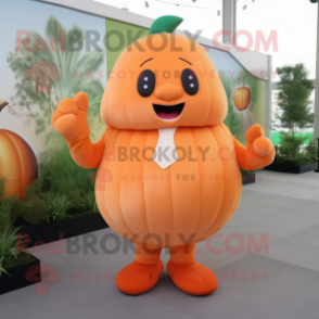 Peach Pumpkin mascot costume character dressed with a Long Sleeve Tee and Tie pins