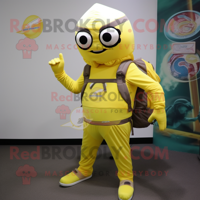Lemon Yellow Commando mascot costume character dressed with a Long Sleeve Tee and Messenger bags