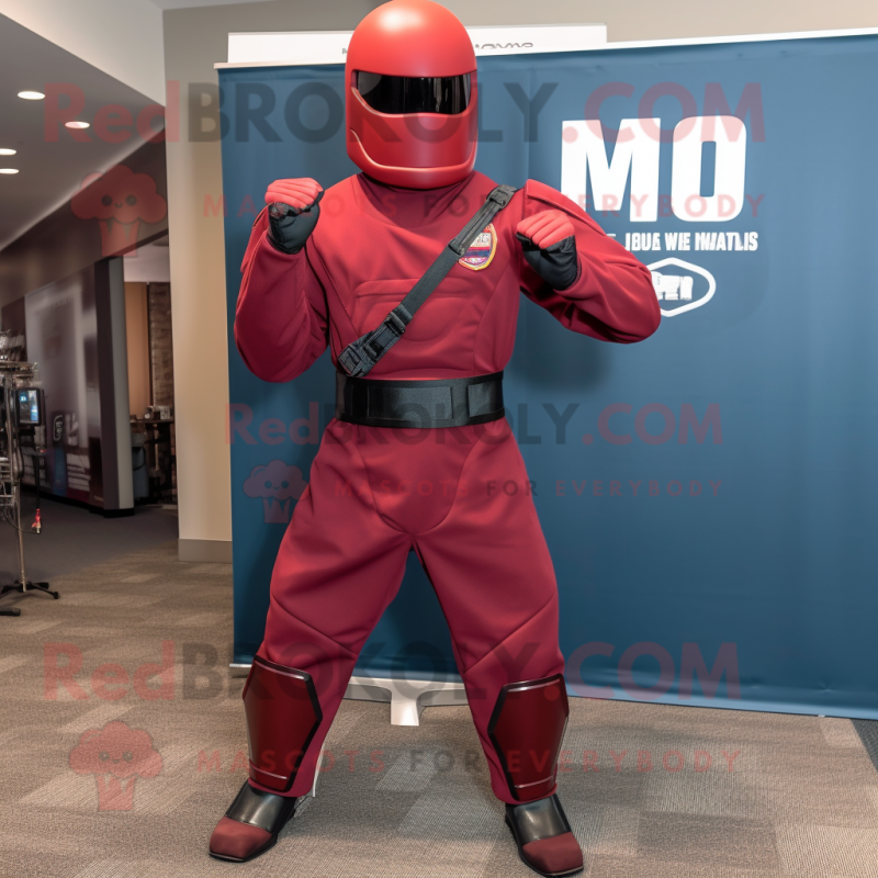 Maroon Gi Joe mascot costume character dressed with a Suit Pants and Suspenders