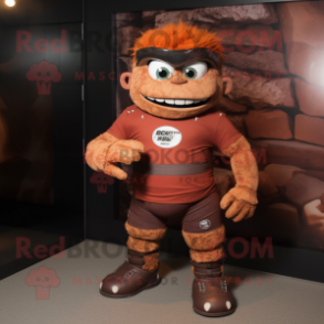 Rust Cyclops mascot costume character dressed with a Rugby Shirt and Belts