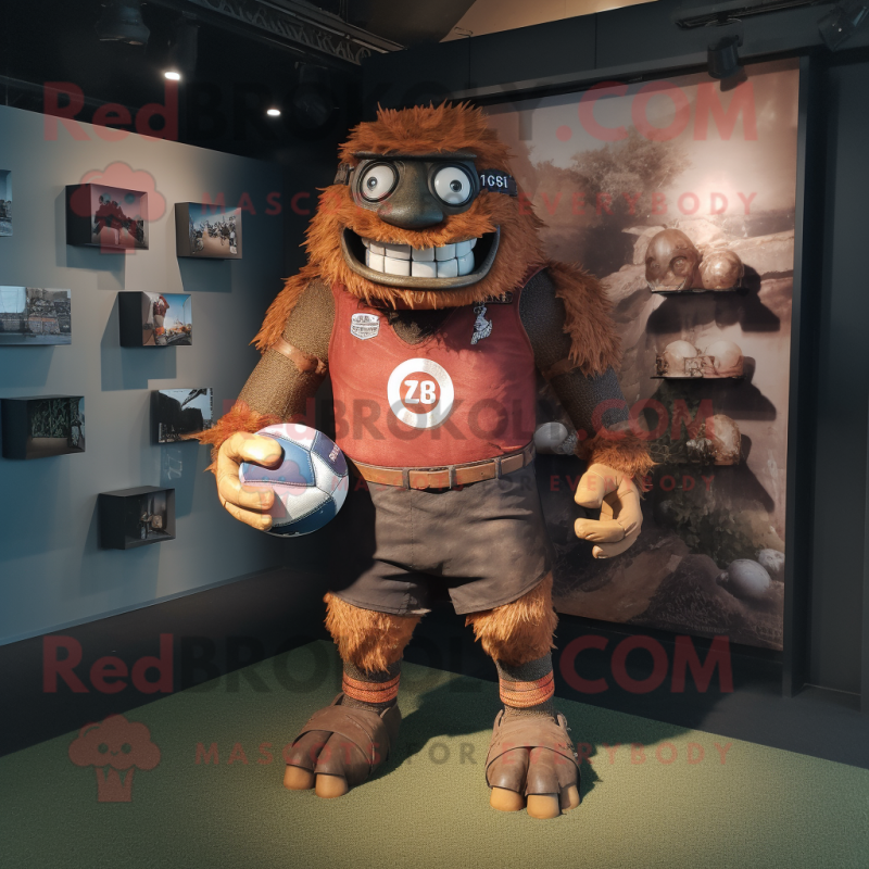 Rust Cyclops mascot costume character dressed with a Rugby Shirt and Belts