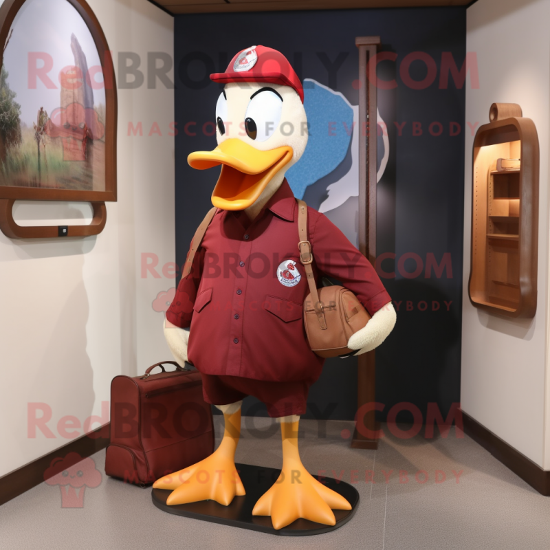 Maroon Muscovy Duck mascot costume character dressed with a Polo Tee and Messenger bags