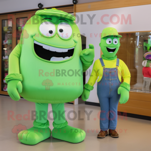 Green Candy Box mascot costume character dressed with a Mom Jeans and Briefcases