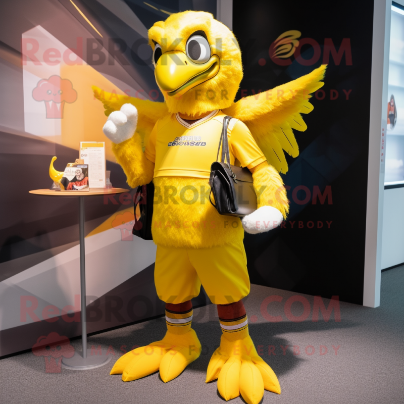Yellow Eagle mascot costume character dressed with a Running Shorts and Wallets
