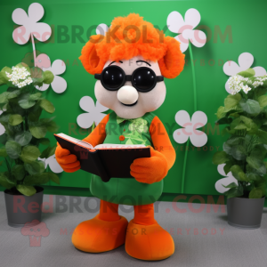 Orange Bunch Of Shamrocks mascot costume character dressed with a Vest and Reading glasses